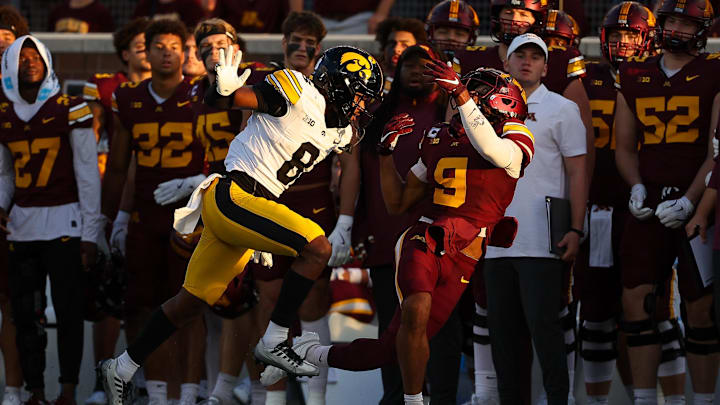 Sep 21, 2024; Minneapolis, Minnesota, USA; Iowa Hawkeyes defensive back Deshaun Lee (8) breaks up a pass intended for Minnesota Golden Gophers wide receiver Daniel Jackson (9) during the first half at Huntington Bank Stadium. Mandatory Credit: Matt Krohn-Imagn Images Sep 21, 2024; Minneapolis, Minnesota, USA; Iowa Hawkeyes defensive back Deshaun Lee (8) breaks up a pass intended for Minnesota Golden Gophers wide receiver Daniel Jackson (9) during the first half at Huntington Bank Stadium. Mandatory Credit: Matt Krohn-Imagn Images