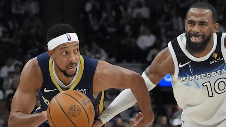 Mar 21, 2025; Minneapolis, Minnesota, USA; New Orleans Pelicans guard CJ McCollum (3) works around Minnesota Timberwolves guard Mike Conley (10) in the third quarter at Target Center. Mandatory Credit: Bruce Kluckhohn-Imagn Images