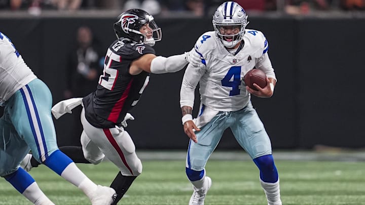 Dallas Cowboys quarterback Dak Prescott is tackled from behind by Atlanta Falcons linebacker Kaden Elliss. Dallas Cowboys quarterback Dak Prescott is tackled from behind by Atlanta Falcons linebacker Kaden Elliss.