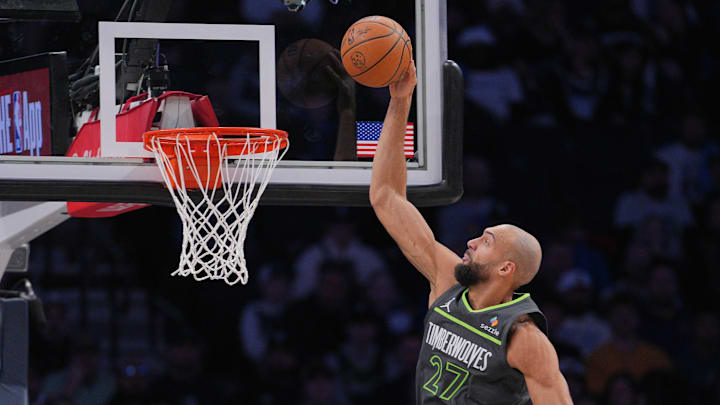Jan 26, 2026; Minneapolis, Minnesota, USA; Minnesota Timberwolves center Rudy Gobert (27) dunks against the Golden State Warriors in the second quarter at Target Center. 