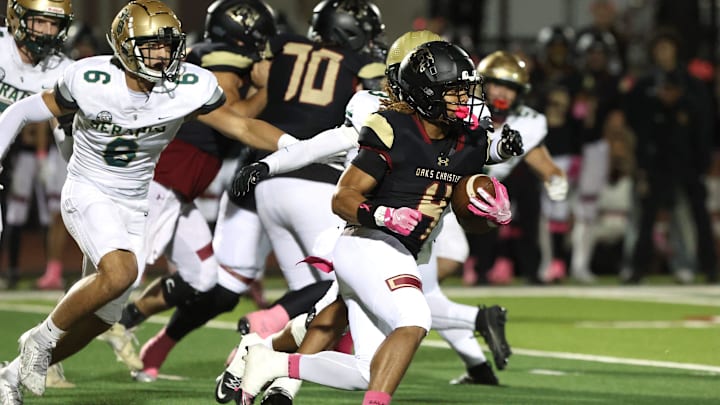 Running back Deshonne Redeaux finds an opening during the first quarter of Oaks Christian's 35-0 Marmonte League win over St. Bonaventure Friday night at Redell Field.