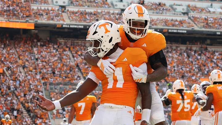 Sep 5, 2026; Knoxville, Tennessee, USA;  Tennessee Volunteers quarterback Faizon Brandon (11) and running back DeSean Bishop (18) celebrate a touchdown against the Furman Paladins during the first half at Neyland Stadium.  Mandatory Credit: Randy Sartin-Imagn Images