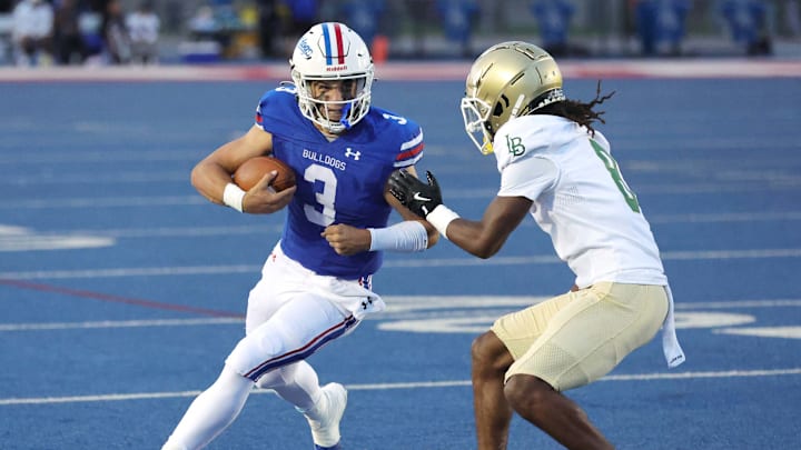 Ryder Lyons prepares to take on a Long Beach Poly defender.