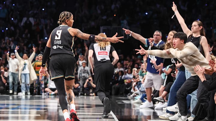 May 17, 2025; Brooklyn, New York, USA;  New York Liberty guard Natasha Cloud (9) celebrates after scoring in the fourth quarter against the Las Vegas Aces at Barclays Center. Mandatory Credit: Wendell Cruz-Imagn Images