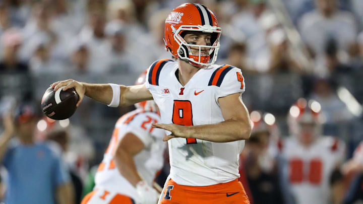Sep 28, 2024; University Park, Pennsylvania, USA; Illinois Fighting Illini quarterback Luke Altmyer (9) throws a pass during the first quarter against the Penn State Nittany Lions at Beaver Stadium. Mandatory Credit: Matthew O'Haren-Imagn Images