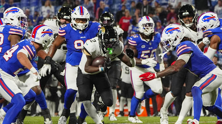 Sep 23, 2024; Orchard Park, New York, USA; Jacksonville Jaguars running back D'Ernest Johnson (2) runs against the Buffalo Bills during the second half at Highmark Stadium. 