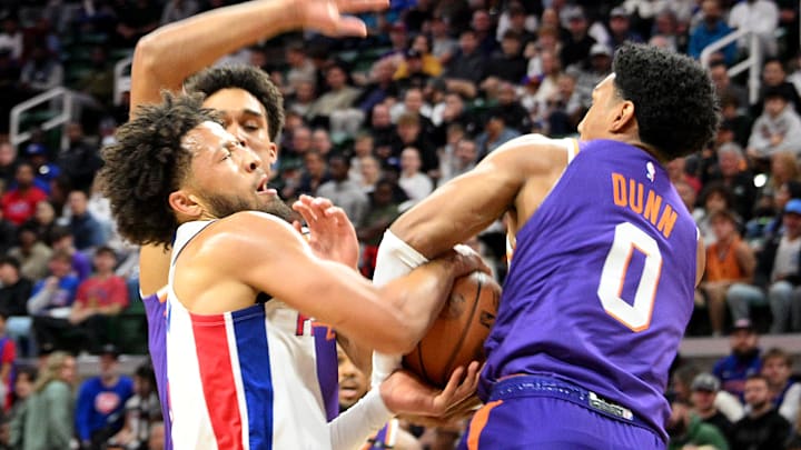 Oct 8, 2024; East Lansing, Michigan, USA;  Detroit Pistons guard Cade Cunningham (2) loses the ball to Phoenix Suns forward Ryan Dunn (0) at Jack Breslin Student Events Center. Mandatory Credit: Dale Young-Imagn Images