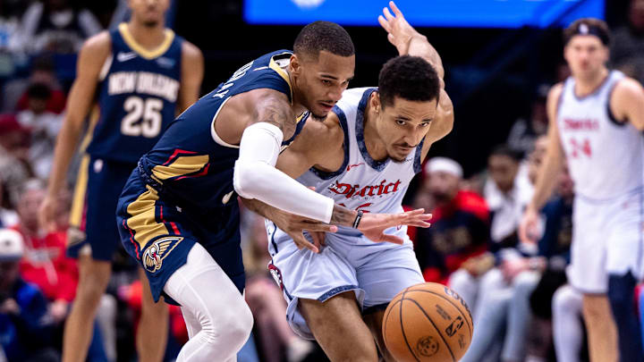 Jan 3, 2025; New Orleans, Louisiana, USA;  New Orleans Pelicans guard Dejounte Murray (5) steals the ball from Washington Wizards guard Malcolm Brogdon (15) during the second half at Smoothie King Center. Mandatory Credit: Stephen Lew-Imagn Images