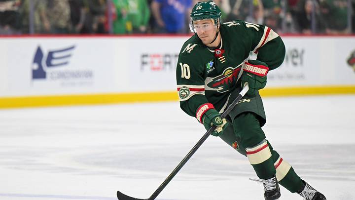 Mar 21, 2026; Saint Paul, Minnesota, USA;  Minnesota Wild forward Bobby Brink (10) controls the puck against the Dallas Stars in overtime at Grand Casino Arena.