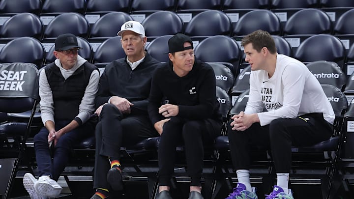 Feb 6, 2024; Salt Lake City, Utah, USA; From left to right, Utah Jazz general manager Justin Zanik, CEO Danny Ainge, owner Ryan Smith and head coach Will Hardy sit court side before the game between the Utah Jazz and the Oklahoma City Thunder at Delta Center. Mandatory Credit: Rob Gray-Imagn Images