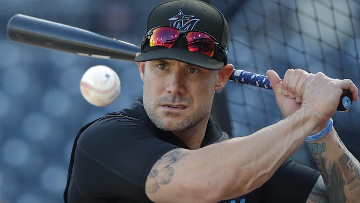 Sep 10, 2024; Pittsburgh, Pennsylvania, USA;  Miami Marlins manager Skip Schumaker (45) hits ground balls during batting practice before a game against the Pittsburgh Pirates at PNC Park. Mandatory Credit: Charles LeClaire-Imagn Images