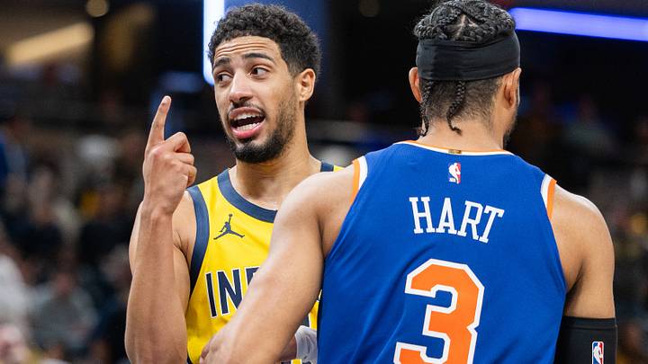 Nov 10, 2024; Indianapolis, Indiana, USA;  Indiana Pacers guard Tyrese Haliburton (0) celebrates a call in the while talking to New York Knicks guard Josh Hart (3) during the second half  at Gainbridge Fieldhouse. Mandatory Credit: Trevor Ruszkowski-Imagn Images