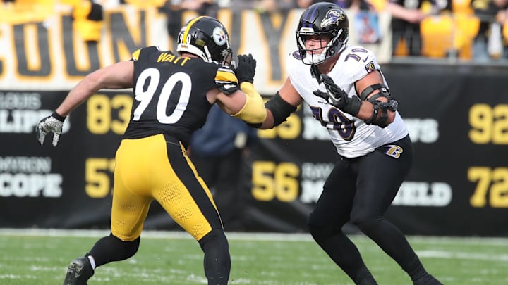 Ravens offensive tackle Roger Rosengarten (70), the former Husky, blocks Steelers linebacker T.J. Watt (90) during their playoff game. 