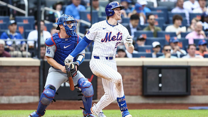 New York Mets third base Brett Baty (22) hits a single in the third inning against the Los Angeles Dodgers at Citi Field. 