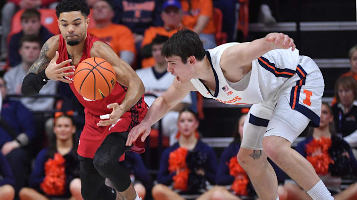 Feb 10, 2026; Champaign, Illinois, USA;  Wisconsin Badgers guard Nick Boyd (2) pulls the ball away from Illinois Fighting Illini forward David Mirkovic (0) during the second half at State Farm Center. Mandatory Credit: Ron Johnson-Imagn Images