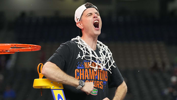 Florida Gators head coach Todd Golden celebrates as he cuts down the net
