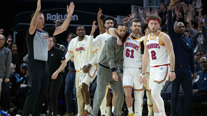 Mar 18, 2025; San Francisco, California, USA; The Golden State Warriors bench celebrates a 3-point basket against the Milwaukee Bucks during the fourth quarter at Chase Center. Mandatory Credit: D. Ross Cameron-Imagn Images