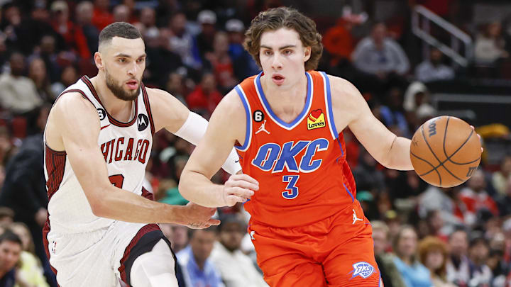 Jan 13, 2023; Chicago, Illinois, USA; Oklahoma City Thunder guard Josh Giddey (3) drives to the basket past Chicago Bulls guard Zach LaVine (8) during the second half at United Center. Mandatory Credit: Kamil Krzaczynski-Imagn Images