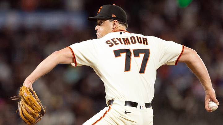 Aug 27, 2026; San Francisco, California, USA;  San Francisco Giants pitcher Carson Seymour (77) delivers a pitch against the Arizona Diamondbacks during the eighth inning at Oracle Park.  Mandatory Credit: D. Ross Cameron-Imagn Images