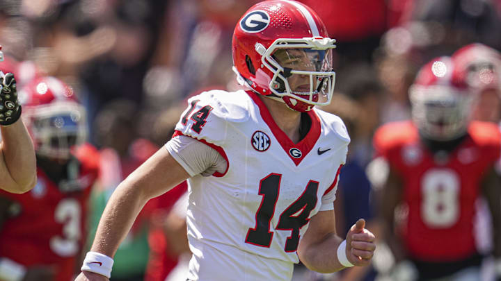 Apr 12, 2025; Athens, GA, USA; Georgia Bulldogs quarterback Gunner Stockton (14) runs on the field prior to the start of the Georgia Spring game at Sanford Stadium. Mandatory Credit: Dale Zanine-Imagn Images