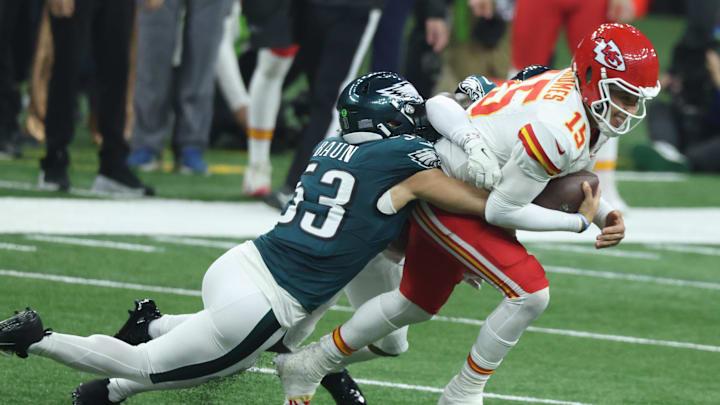 Feb 9, 2025; New Orleans, LA, USA;  Kansas City Chiefs quarterback Patrick Mahomes (15) is tackled by Philadelphia Eagles linebacker Zack Baun (53) in Super Bowl LIX between the Philadelphia Eagles and the Kansas City Chiefs at Ceasars Superdome. Mandatory Credit: Stephen Lew-Imagn Images