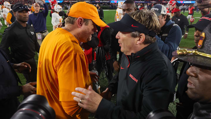 Nov 16, 2024; Athens, Georgia, USA; Tennessee Volunteers head coach Josh Heupel talks to Georgia Bulldogs head coach Kirby Smart after a game at Sanford Stadium. Mandatory Credit: Brett Davis-Imagn Images