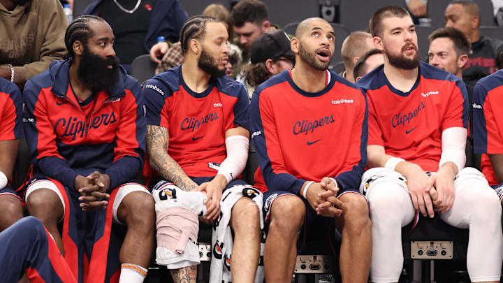 Dec 4, 2024; Inglewood, California, USA;  Los Angeles Clippers guard James Harden (1, left), guard Amir Coffey (7), forward Nicolas Batum (33) and center Ivica Zubac (40, right) watch from the bench during the second half against the Minnesota Timberwolves at Intuit Dome. Mandatory Credit: Kiyoshi Mio-Imagn Images