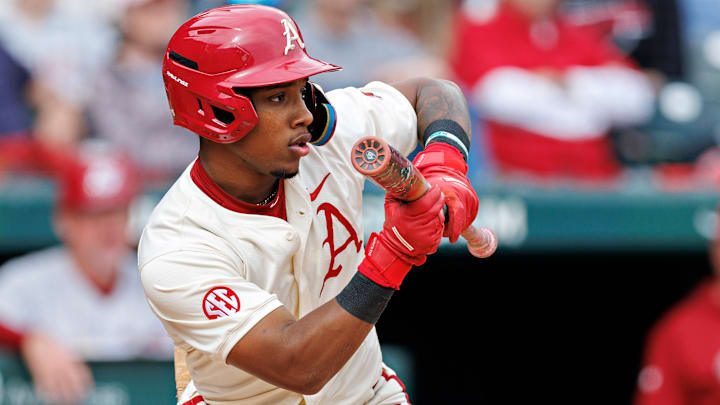 Justin Thomas Jr. shows bunt at the plate for the Arkansas Razorbacks. 