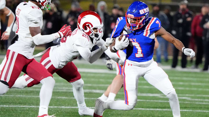 Bixby's Braeden Presley tries to get away from Owasso's Carter Langenderfer during the Class 6A-I state football championship game between Owasso and Bixby at Chad Richison Stadium in Edmond, Okla., Friday, Dec. 6, 2024.