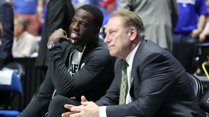 Mar 19, 2017; Tulsa, OK, USA; Golden State Warriors power forward Draymond Green speaks to Michigan State Spartans head coach Tom Izzo before the game between the Kansas Jayhawks and the Michigan State Spartans in the second round of the 2017 NCAA Tournament at BOK Center. Mandatory Credit: Brett Rojo-Imagn Images