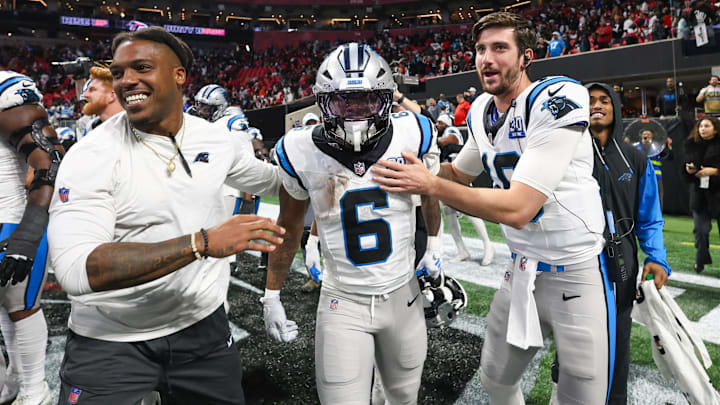 Jan 5, 2025; Atlanta, Georgia, USA; Carolina Panthers running back Miles Sanders (6) celebrates with teammates after a game-winning touchdown in overtime against the Atlanta Falcons at Mercedes-Benz Stadium. Mandatory Credit: Brett Davis-Imagn Images