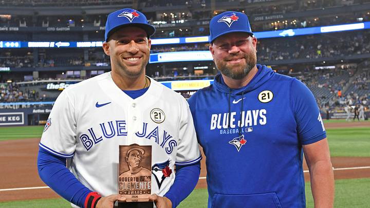 Blue Jays designated hitter George Springer (4) receives the team Roberto Clemente Award from manager John Schneider. Credit: Dan Hamilton-Imagn Blue Jays designated hitter George Springer (4) receives the team Roberto Clemente Award from manager John Schneider. Credit: Dan Hamilton-Imagn