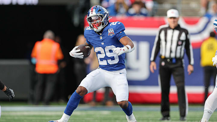 Dec 29, 2024; East Rutherford, New Jersey, USA; New York Giants running back Tyrone Tracy Jr. (29) carries the ball during the first half against the Indianapolis Colts at MetLife Stadium.  