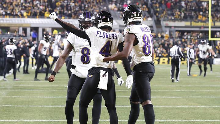Jan 4, 2026; Pittsburgh, Pennsylvania, USA; Baltimore Ravens wide receiver Zay Flowers (4) reacts with  quarterback Lamar Jackson (8) after scoring a touchdown against the Pittsburgh Steelers during the second half at Acrisure Stadium. Mandatory Credit: Charles LeClaire-Imagn Images