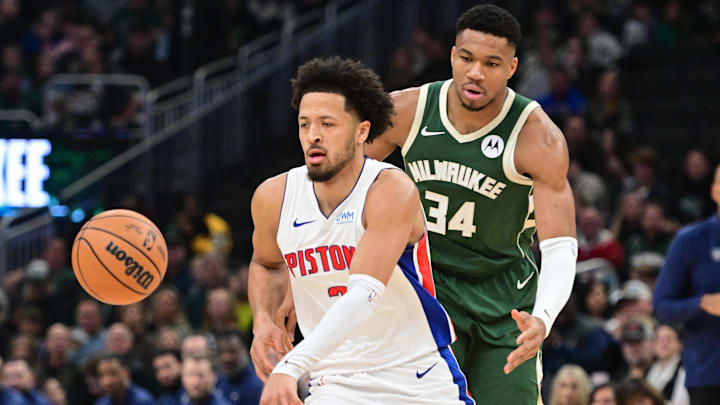 Dec 16, 2023; Milwaukee, Wisconsin, USA;  Detroit Pistons guard Cade Cunningham (2) is guarded by Milwaukee Bucks forward Giannis Antetokounmpo (34) in the first quarter at Fiserv Forum. Mandatory Credit: Benny Sieu-Imagn Images