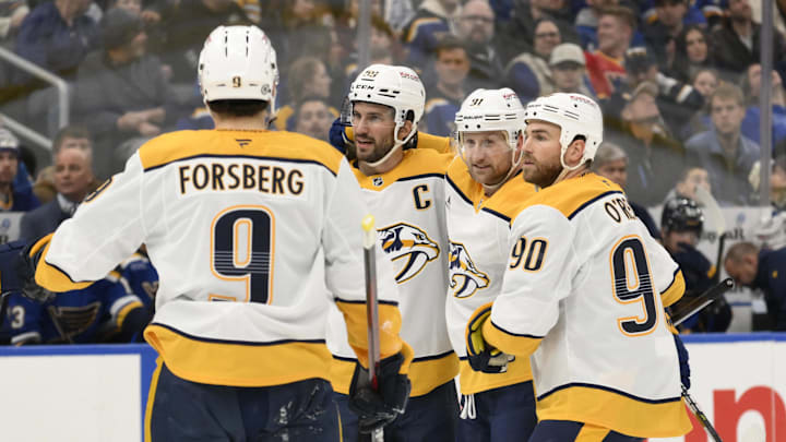 Dec 27, 2024; St. Louis, Missouri, USA; Nashville Predators center Steven Stamkos (91) is congratulated by teammates after scoring a goal against the St. Louis Blues during the first period at Enterprise Center. Mandatory Credit: Jeff Le-Imagn Images