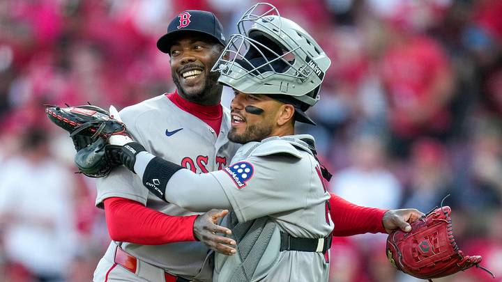 Boston Red Sox pitcher Aroldis Chapman (44) and catcher Carlos Narváez (75) celebrate a win after the ninth inning of the MLB Opening Day game between the Cincinnati Reds and the Boston Red Sox at Great American Ball Park in downtown Cincinnati on Thursday, March 26, 2026. The Reds lost the season opener, 3-0.