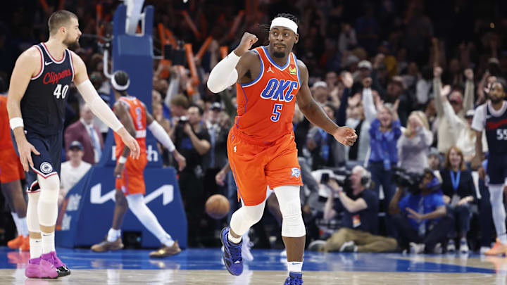 Nov 11, 2024; Oklahoma City, Oklahoma, USA; Oklahoma City Thunder guard Luguentz Dort (5) reacts after forward Jalen Williams dunks against the Los Angeles Clippers during the fourth quarter at Paycom Center. Mandatory Credit: Alonzo Adams-Imagn Images