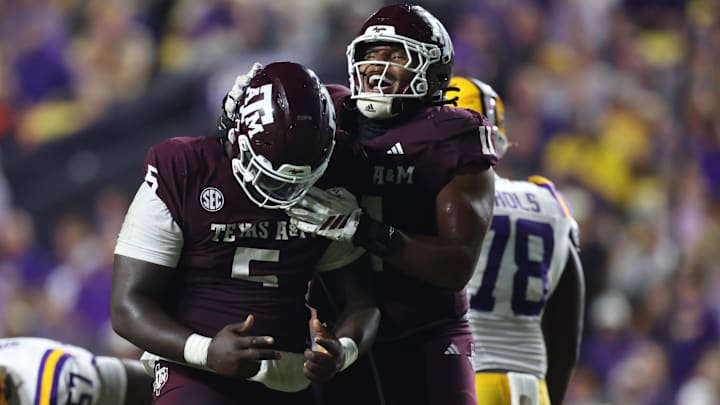 Texas A&M Aggies defensive tackle DJ Hicks celebrates with defensive tackle Tyler Onyedim after a play during the second half against the Louisiana State Tigers at Tiger Stadium. Texas A&M Aggies defensive tackle DJ Hicks celebrates with defensive tackle Tyler Onyedim after a play during the second half against the Louisiana State Tigers at Tiger Stadium.