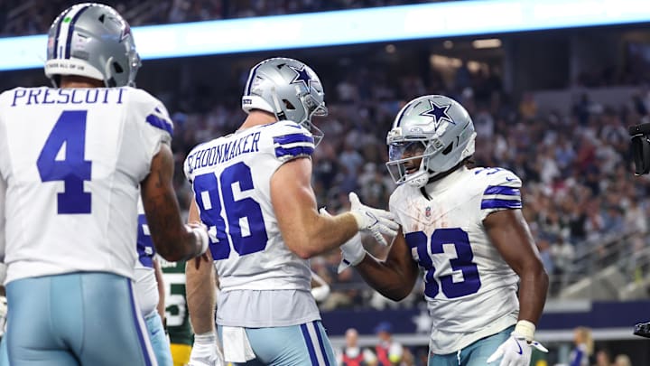 Dallas Cowboys RB Javonte Williams celebrates with TE Luke Schoonmaker after scoring a touchdown against Green Bay.