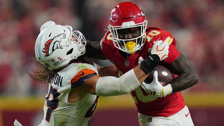 Kansas City Chiefs running back Emmett Johnson (10) rushes the ball against Denver Broncos linebacker Alex Singleton (49) at GEHA Field at Arrowhead Stadium. Kansas City Chiefs running back Emmett Johnson (10) rushes the ball against Denver Broncos linebacker Alex Singleton (49) at GEHA Field at Arrowhead Stadium.