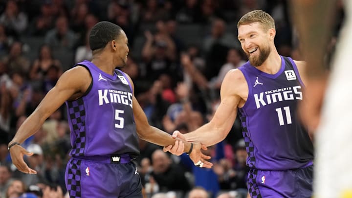 Dec 8, 2024; Sacramento, California, USA; Sacramento Kings forward Domantas Sabonis (11) is congratulated by guard De'Aaron Fox (5) after making a three point basket against the Utah Jazz during the second quarter at Golden 1 Center. 