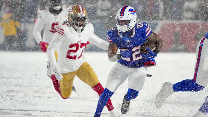 Dec 1, 2024; Orchard Park, New York, USA; Buffalo Bills running back Ray Davis (22) runs with the ball against San Francisco 49ers safety Ji'Ayir Brown (27) during the second half at Highmark Stadium. Mandatory Credit: Gregory Fisher-Imagn Images