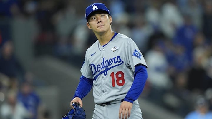 Oct 31, 2025; Toronto, Ontario, CAN; Los Angeles Dodgers pitcher Yoshinobu Yamamoto (18) reacts in the fifth inning against the Toronto Blue Jays during game six of the 2025 MLB World Series at Rogers Centre. Mandatory Credit: John E. Sokolowski-Imagn Images Oct 31, 2025; Toronto, Ontario, CAN; Los Angeles Dodgers pitcher Yoshinobu Yamamoto (18) reacts in the fifth inning against the Toronto Blue Jays during game six of the 2025 MLB World Series at Rogers Centre. Mandatory Credit: John E. Sokolowski-Imagn Images
