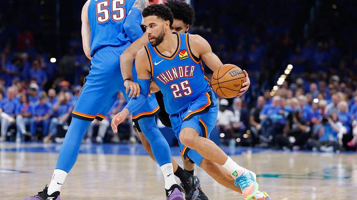 May 18, 2026; Oklahoma City, Oklahoma, USA; Oklahoma City Thunder guard Ajay Mitchell (25) drives the ball in the third quarter against the San Antonio Spurs during game one of the western conference finals for the 2026 NBA playoffs at Paycom Center.