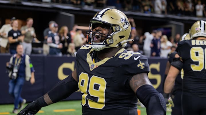 Nov 5, 2023; New Orleans, Louisiana, USA;  New Orleans Saints defensive tackle Khalen Saunders (99) shows emotion after an interception against the Chicago Bears during the second half at the Caesars Superdome. Mandatory Credit: Stephen Lew-Imagn Images