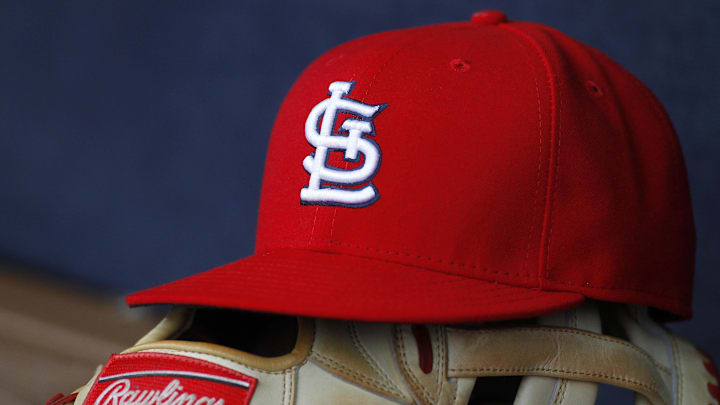 Oct 4, 2015; Atlanta, GA, USA; Detailed view of St. Louis Cardinals hat and glove in the dugout against the Atlanta Braves in the ninth inning at Turner Field. The Braves defeated the Cardinals 2-0. Mandatory Credit: Brett Davis-Imagn Images
