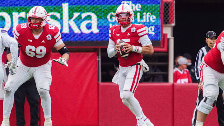 Oct 25, 2025; Lincoln, Nebraska, USA; Nebraska Cornhuskers quarterback Dylan Raiola (15) looks to throw a pass and offensive lineman Turner Corcoran (69) blocks against the Northwestern Wildcats during the third quarter at Memorial Stadium. Mandatory Credit: Dylan Widger-Imagn Images Oct 25, 2025; Lincoln, Nebraska, USA; Nebraska Cornhuskers quarterback Dylan Raiola (15) looks to throw a pass and offensive lineman Turner Corcoran (69) blocks against the Northwestern Wildcats during the third quarter at Memorial Stadium. Mandatory Credit: Dylan Widger-Imagn Images