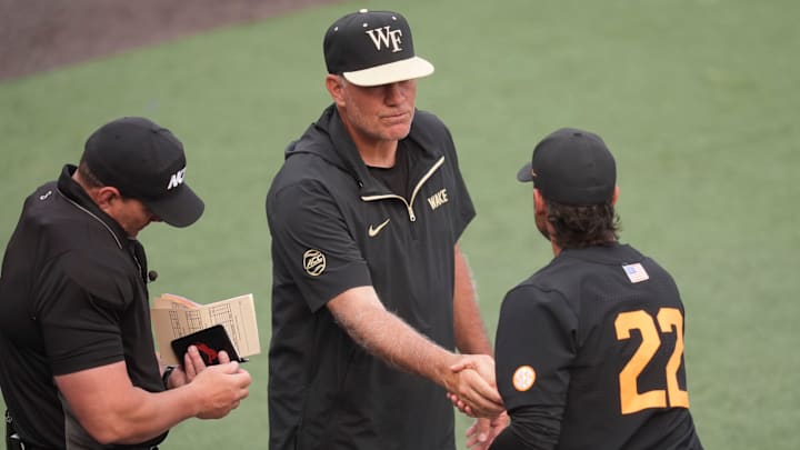 Tennessee baseball coach Tony Vitello shakes hands with Wake Forest baseball coach Tom Walter during the pregame meeting at the NCAA college baseball Knoxville Regional final on June 1, 2025, in Knoxville, Tenn.