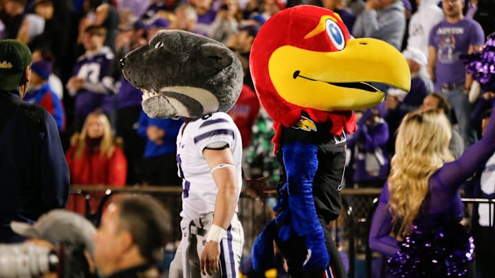 Big Jay and Willie the Wildcat part ways following an interaction at Saturday's Sunflower Showdown. Big Jay and Willie the Wildcat part ways following an interaction at Saturday's Sunflower Showdown.